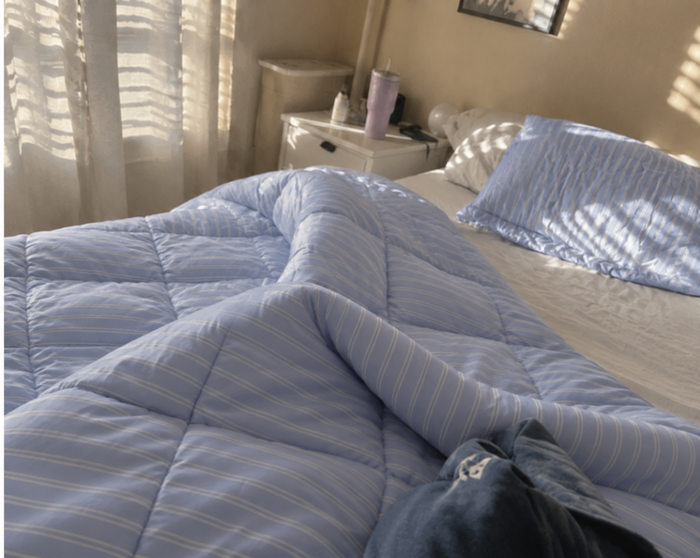 AI-generated demo image of the HelloBed Sky Pinstripe comforter in a home setting.