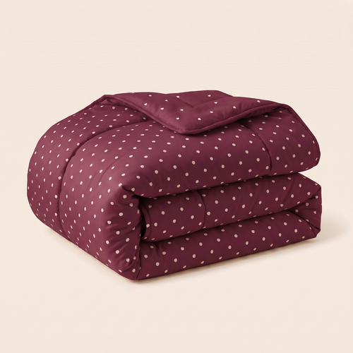 Burgundy Hearts comforter folded on an ivory background