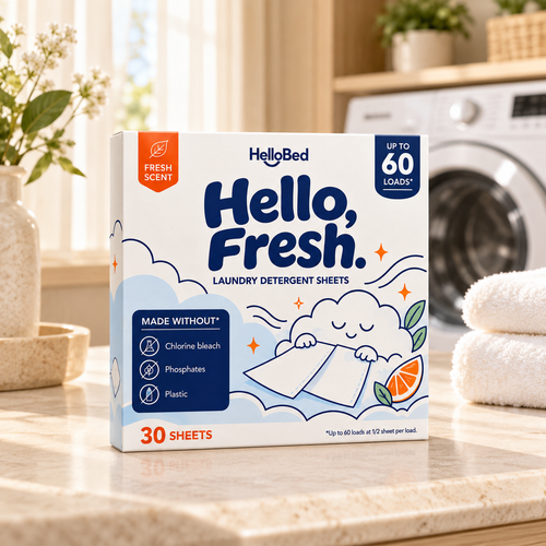 Hello, Fresh detergent sheets box on a stone countertop beside folded towels in a laundry room.